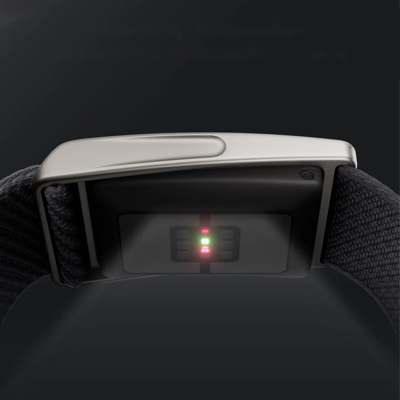 Close-up of the Speediance Strap sensor underside with green and red LEDs