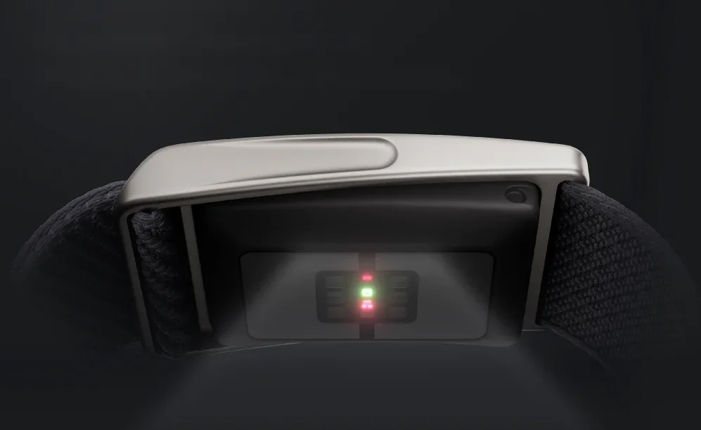 Close-up of the Speediance Strap sensor underside with green and red LEDs